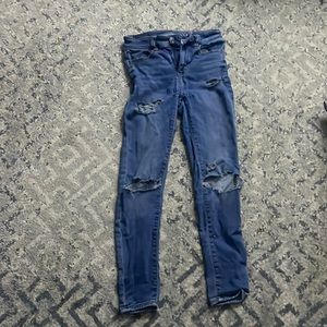 Dark blue American eagle ripped jeans.